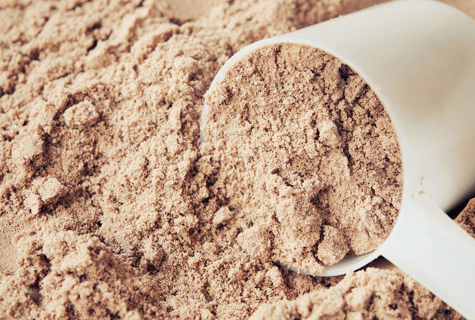 A scoop of chocolate protein powder