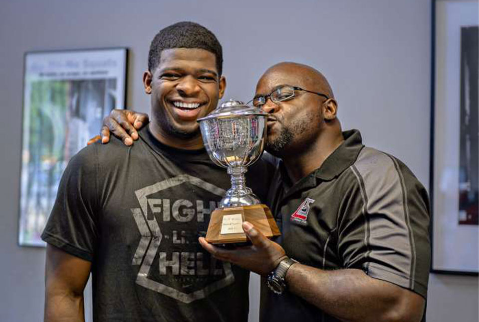 Clance Laylor and P.K. Subban holding the Noris Trophy.