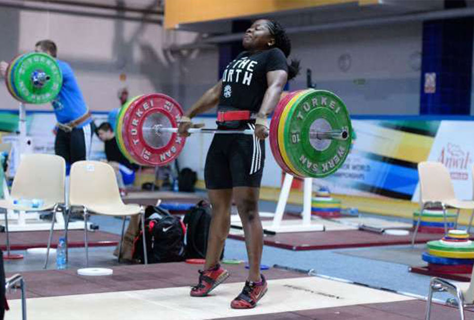 Maya Laylor performing an Olympic lift at a competition