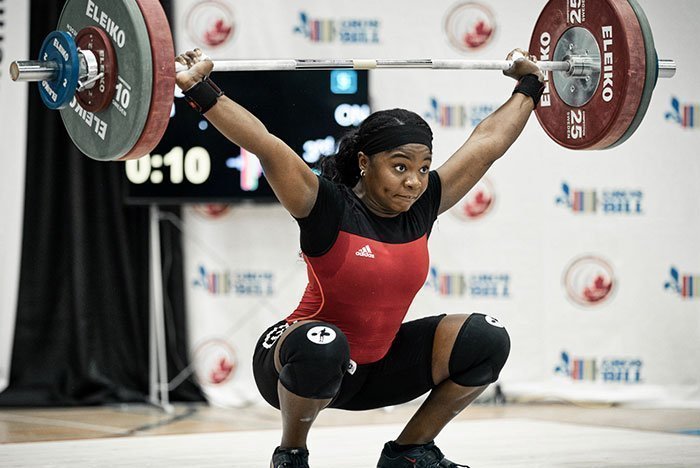 Maya Laylor performning a snatch at an Olympic Weightlifting competition