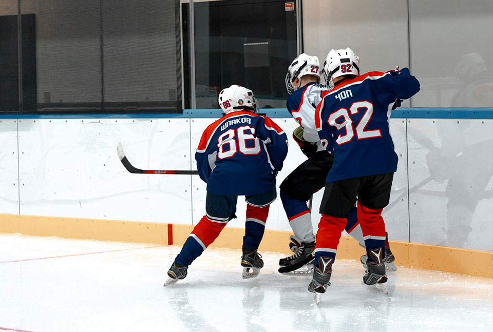 Kids playing hockey, weak one injures